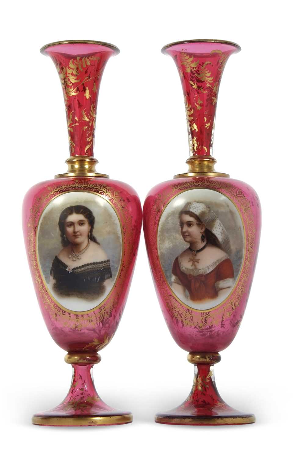A pair of 19th Century continental ruby glass vases, finely painted with panels of young girls