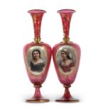 A pair of 19th Century continental ruby glass vases, finely painted with panels of young girls
