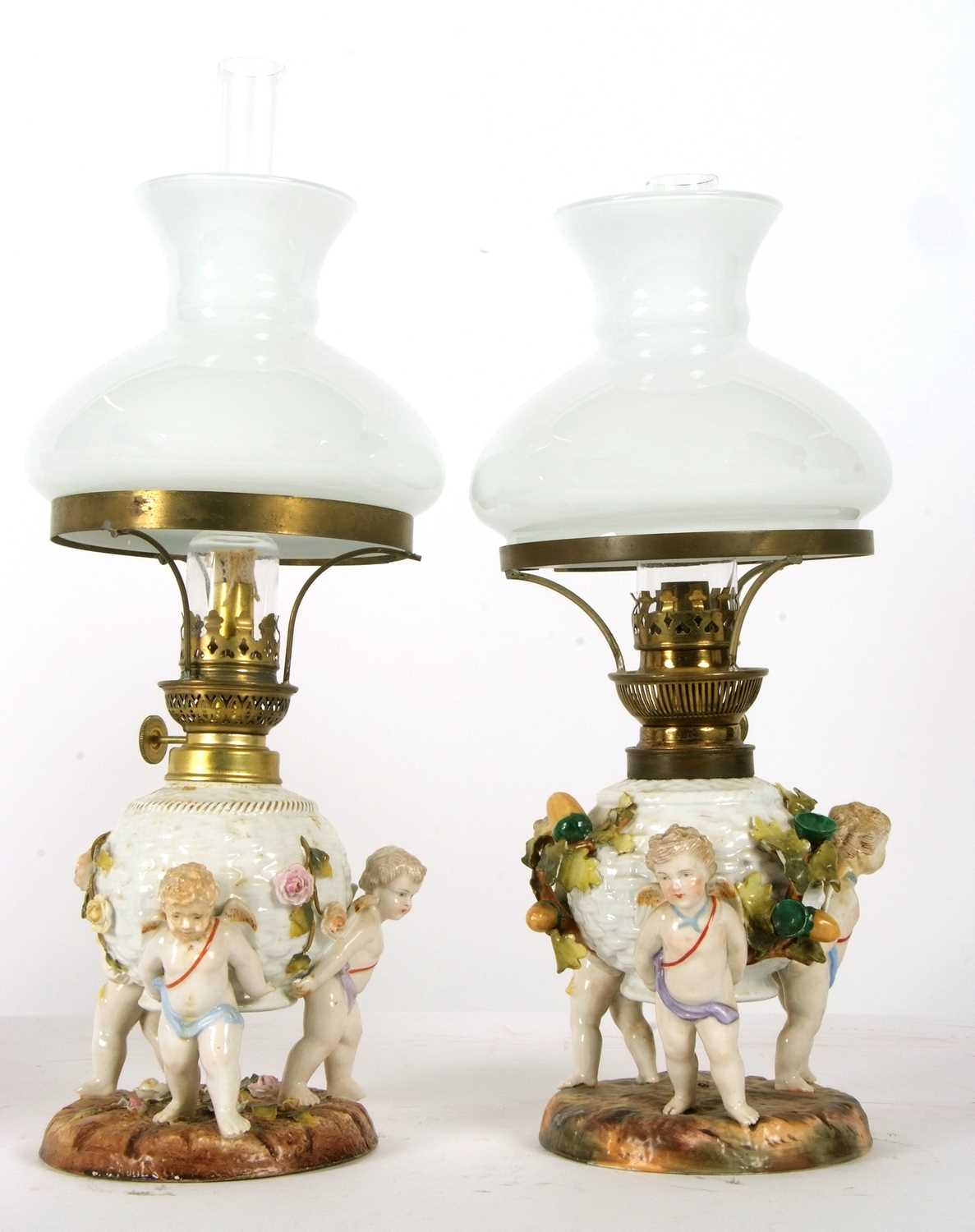 A pair of continental porcelain lamps with white frosted shades, the lamps decorated in the - Image 3 of 8