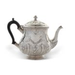 Edwardian silver teapot of slight baluster form, the hinged lid and body decorated with a fluted and