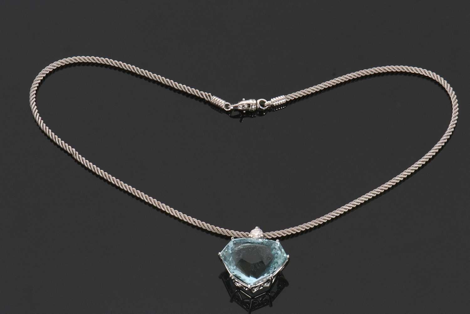An aquamarine and diamond necklace, the heart shaped mixed cut aquamarine, approx. 37cts, claw