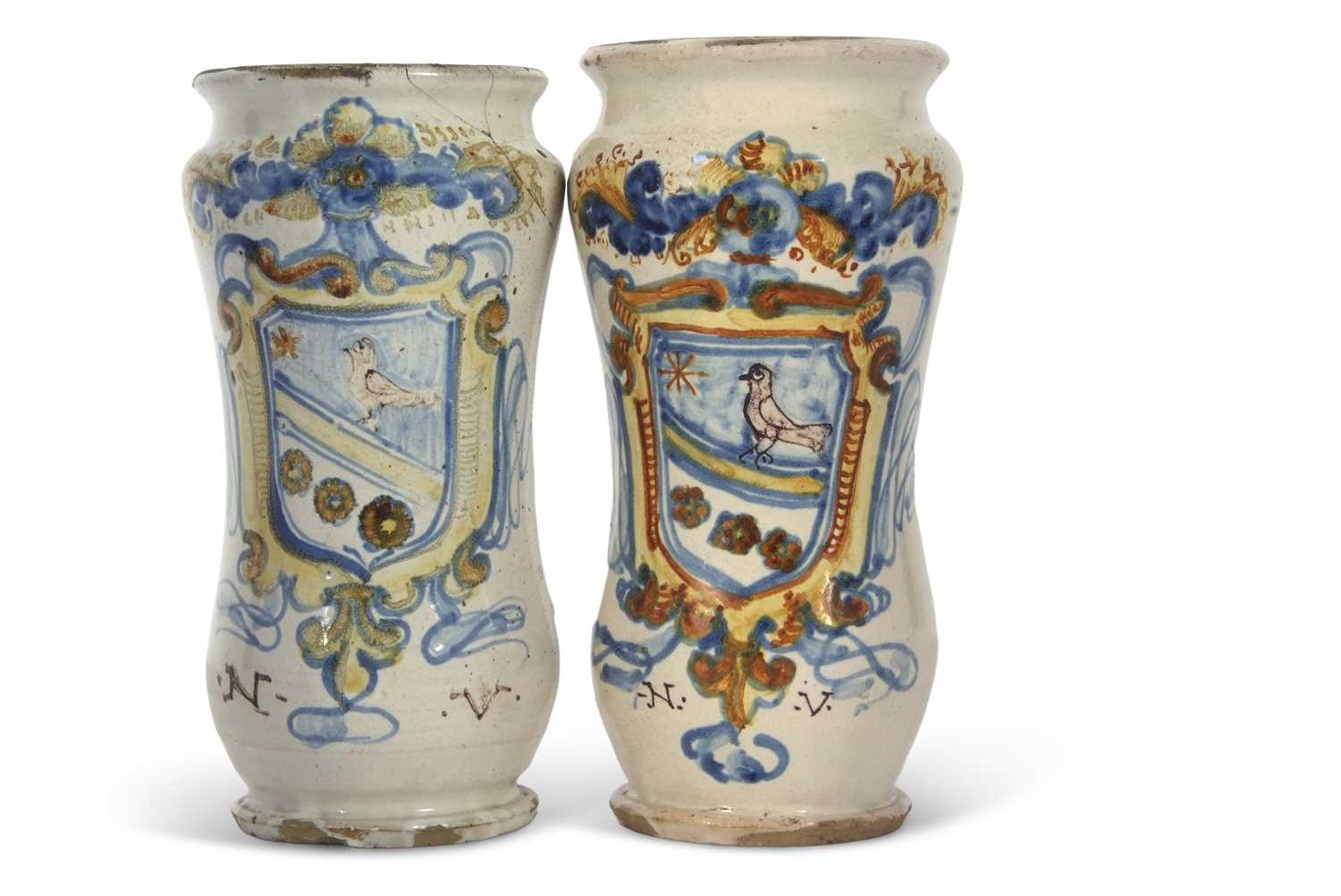 A pair of Italian Faience Alberelli with polychrome designs of an armorial with the initials NV,