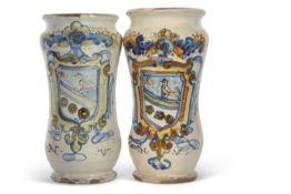 A pair of Italian Faience Alberelli with polychrome designs of an armorial with the initials NV,