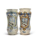 A pair of Italian Faience Alberelli with polychrome designs of an armorial with the initials NV,