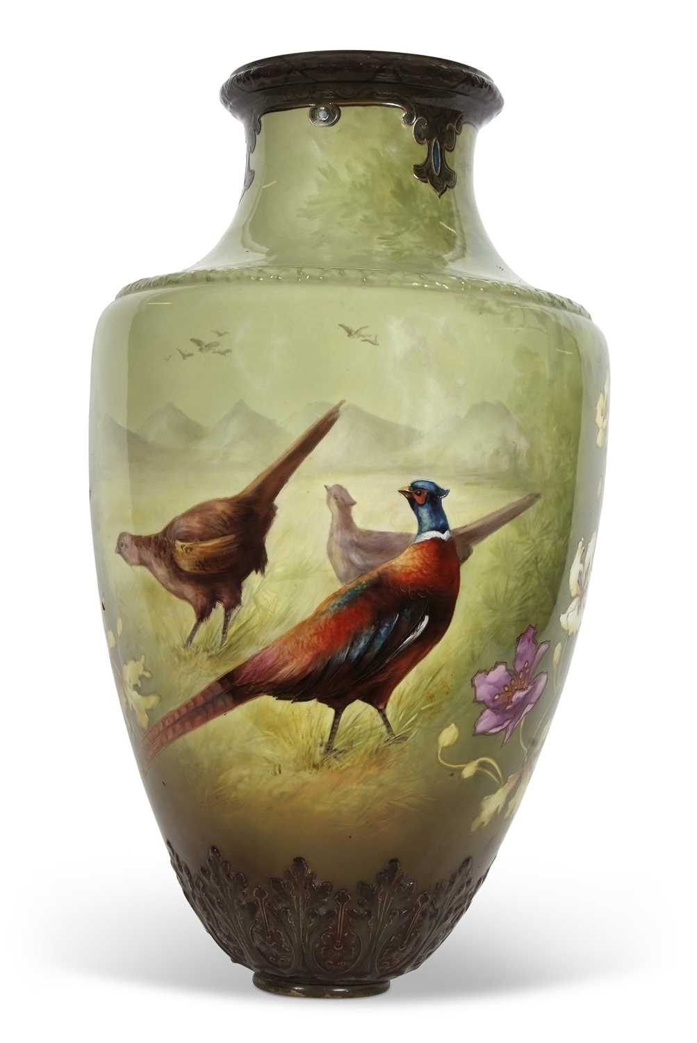A very large Art Nouveau style vase, the green ground painted with pheasants and flowers, probably