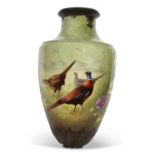 A very large Art Nouveau style vase, the green ground painted with pheasants and flowers, probably