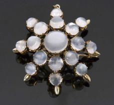 A moonstone 'star' brooch, the star shape comprised of graduated round moonstone cabochons, all claw