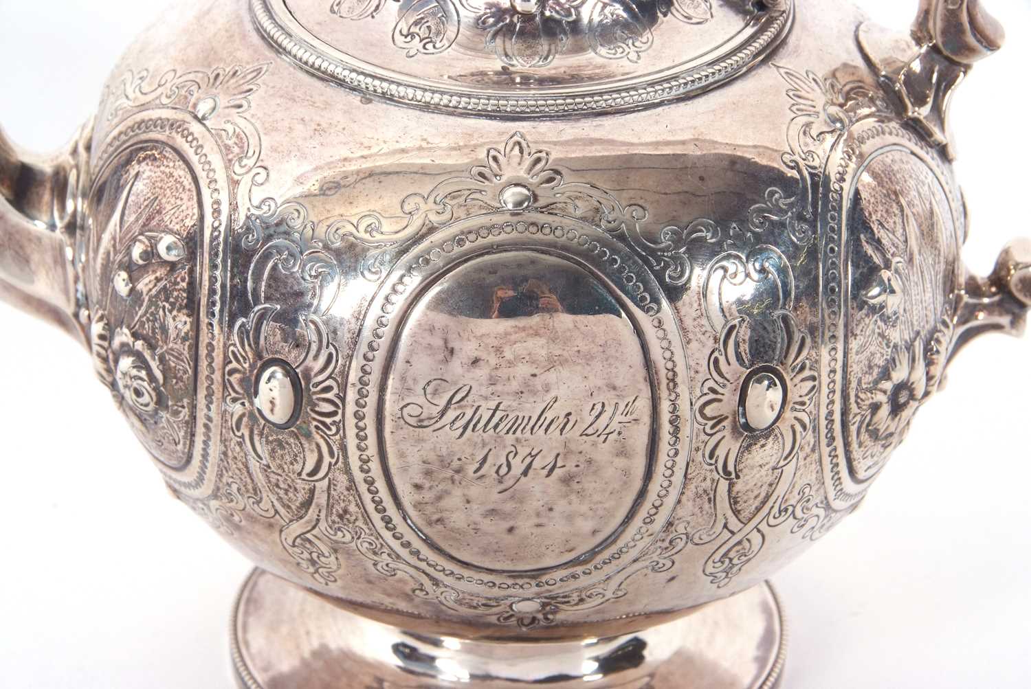 A Victorian silver teapot of globular bullet shaped onto a cast beaded circular spreading foot, - Image 5 of 7