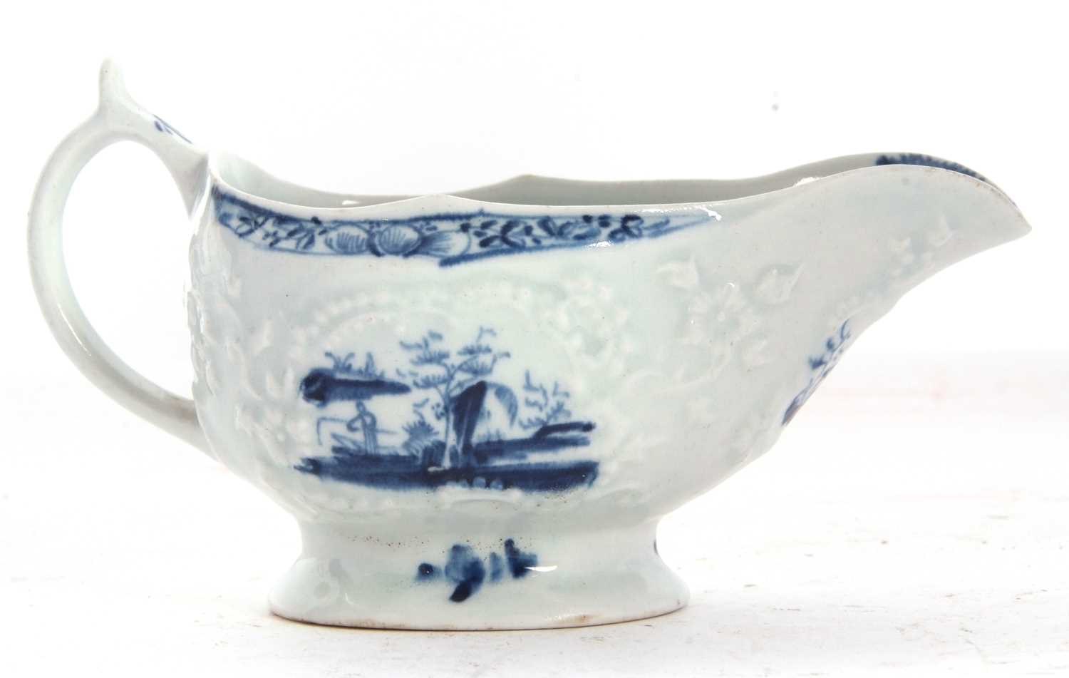 A small Lowestoft sauce boat with reserves of Chinoiserie scenes, the moulded body decorated with - Image 2 of 4