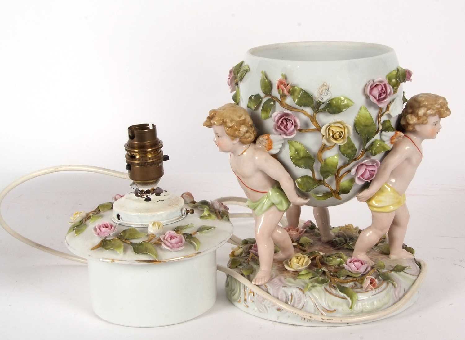 A large continental porcelain lamp base, the lamp base supported by three large cherubs with applied - Image 6 of 8