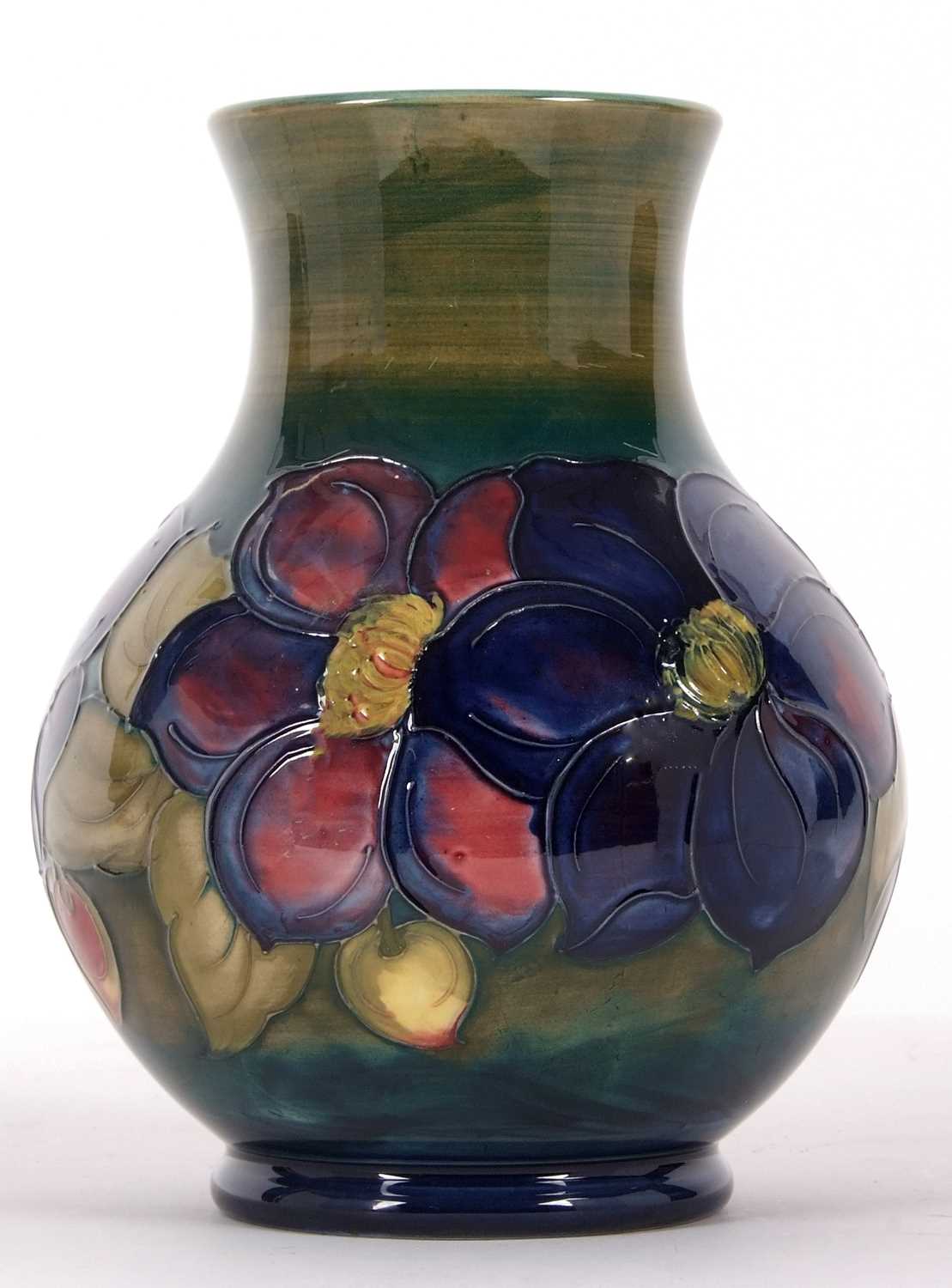 A Moorcroft vase, the baluster body with tubelined decoration with the anemone pattern on a green - Image 3 of 4
