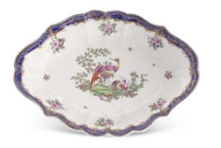 An 18th Century Worcester fluted dish, well painted to the centre with exotic birds, surrounded by
