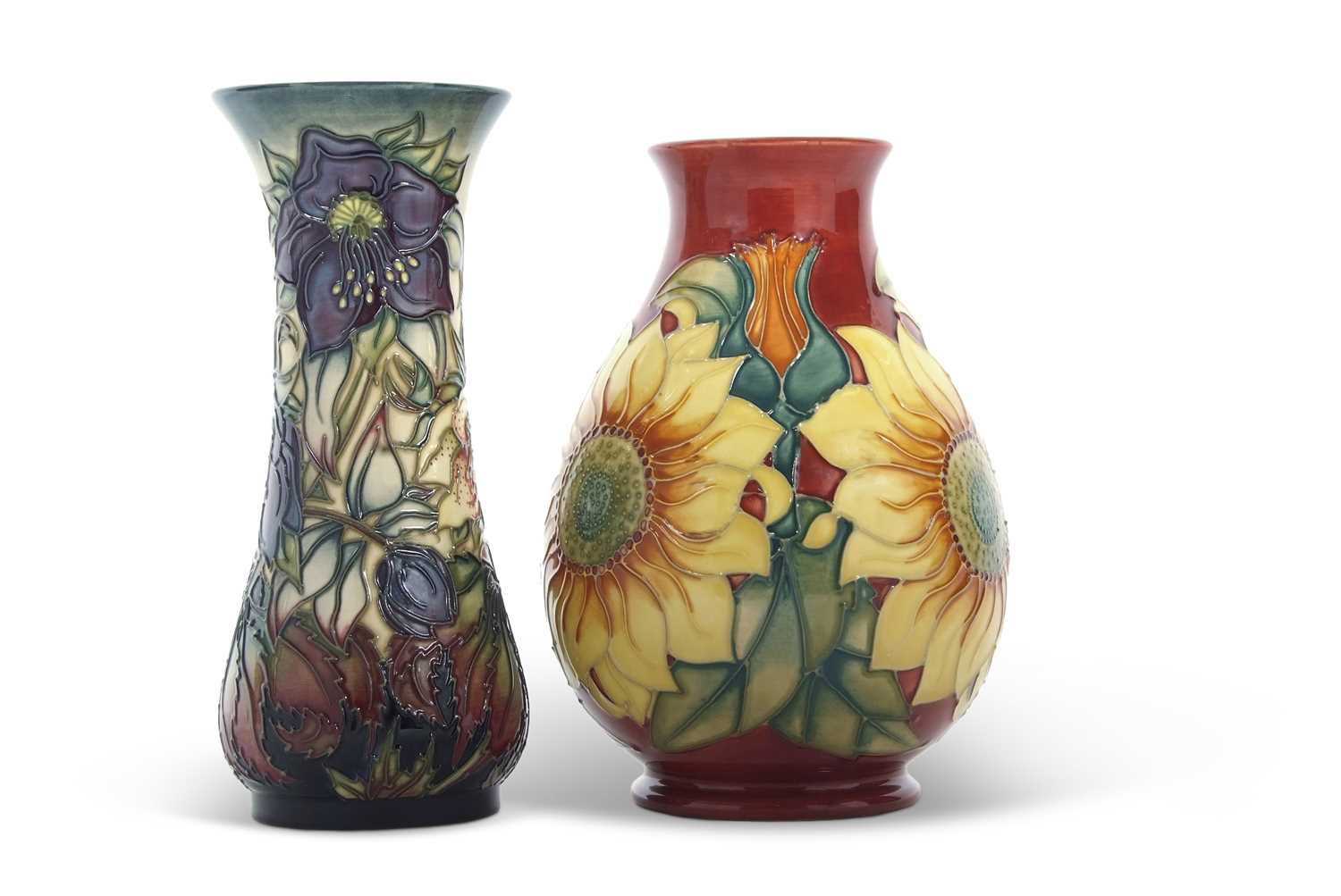 Two Moorcroft vases with modern designs, the first of baluster shape with sunflower design, and
