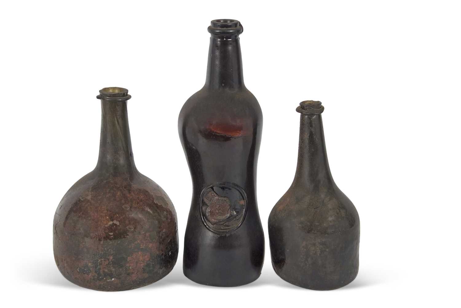 A group of three 18th Century wine bottles, one of onion shape, a further bottle of double gourd