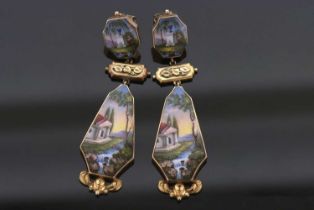 A pair of late 19th/early 20th century Italianate enamelled earrings, the panels painted with