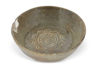 A Chinese pottery dish possibly Han Dynasty with a centre of geometric motif (repair to rim), 12cm