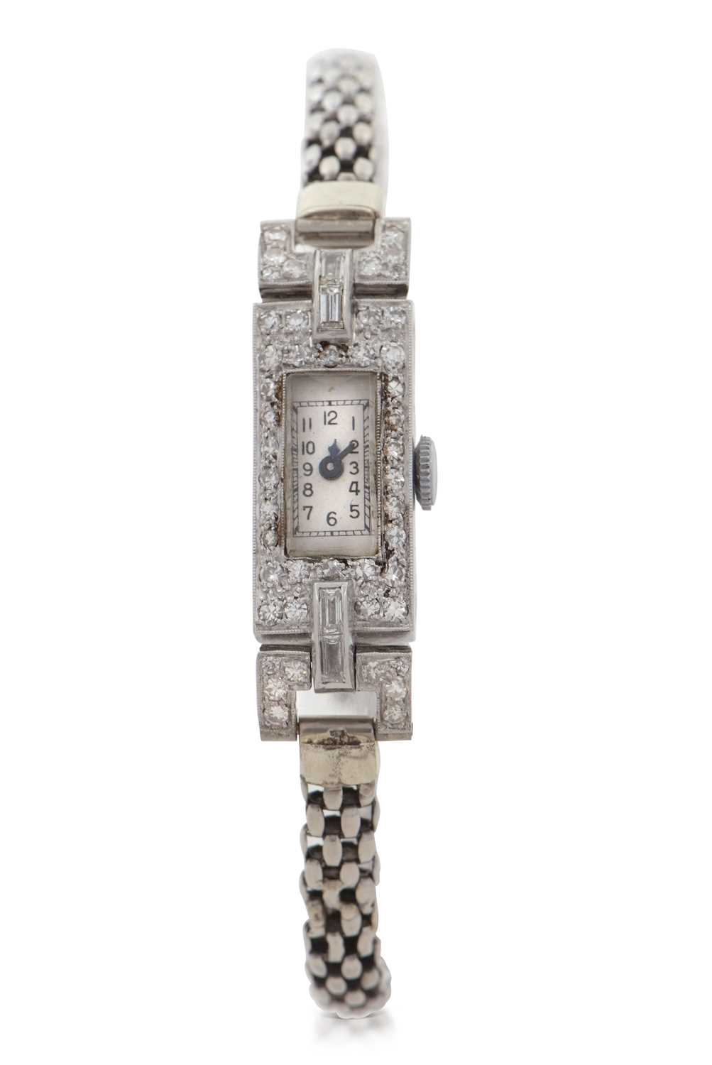 An Art Deco precious metal and diamond ladies wristwatch, the end link of the bracelet is stamped