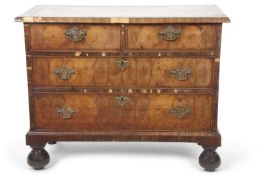 An early 18th Century and later walnut four drawer chest with two short and two long drawers
