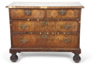 An early 18th Century and later walnut four drawer chest with two short and two long drawers