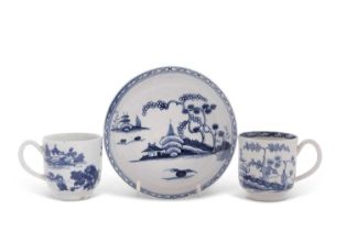 A Liverpool porcelain cup and saucer painted in underglaze blue with a Chinoiserie design, the