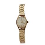 A 9ct gold ladies Omega watch, it has a manually crown wound movement, the watch is hallmarked on