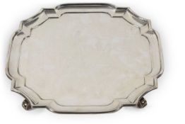 George VI Silver salver of square form having shaped and cut corners with a Chippendale patterned