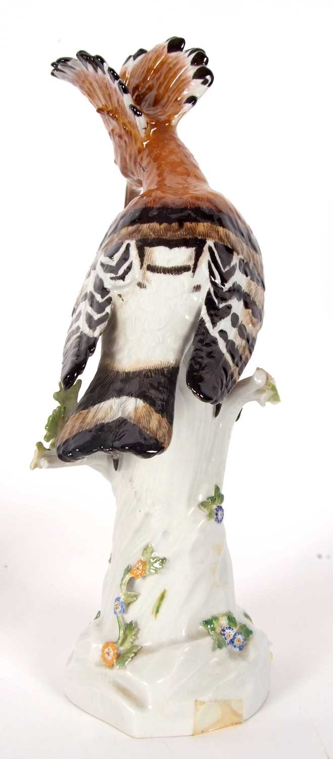 A Meissen model of a Hoopoe bird on a tree trunk, the trunk decorated with insects and flowers, blue - Image 3 of 6