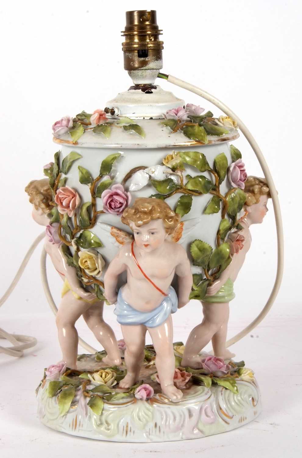 A large continental porcelain lamp base, the lamp base supported by three large cherubs with applied - Image 3 of 8