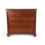 A late Georgian mahogany chest of drawers with moulded top over two short and three long drawers