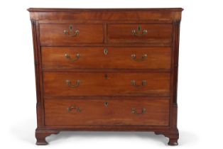 A late Georgian mahogany chest of drawers with moulded top over two short and three long drawers