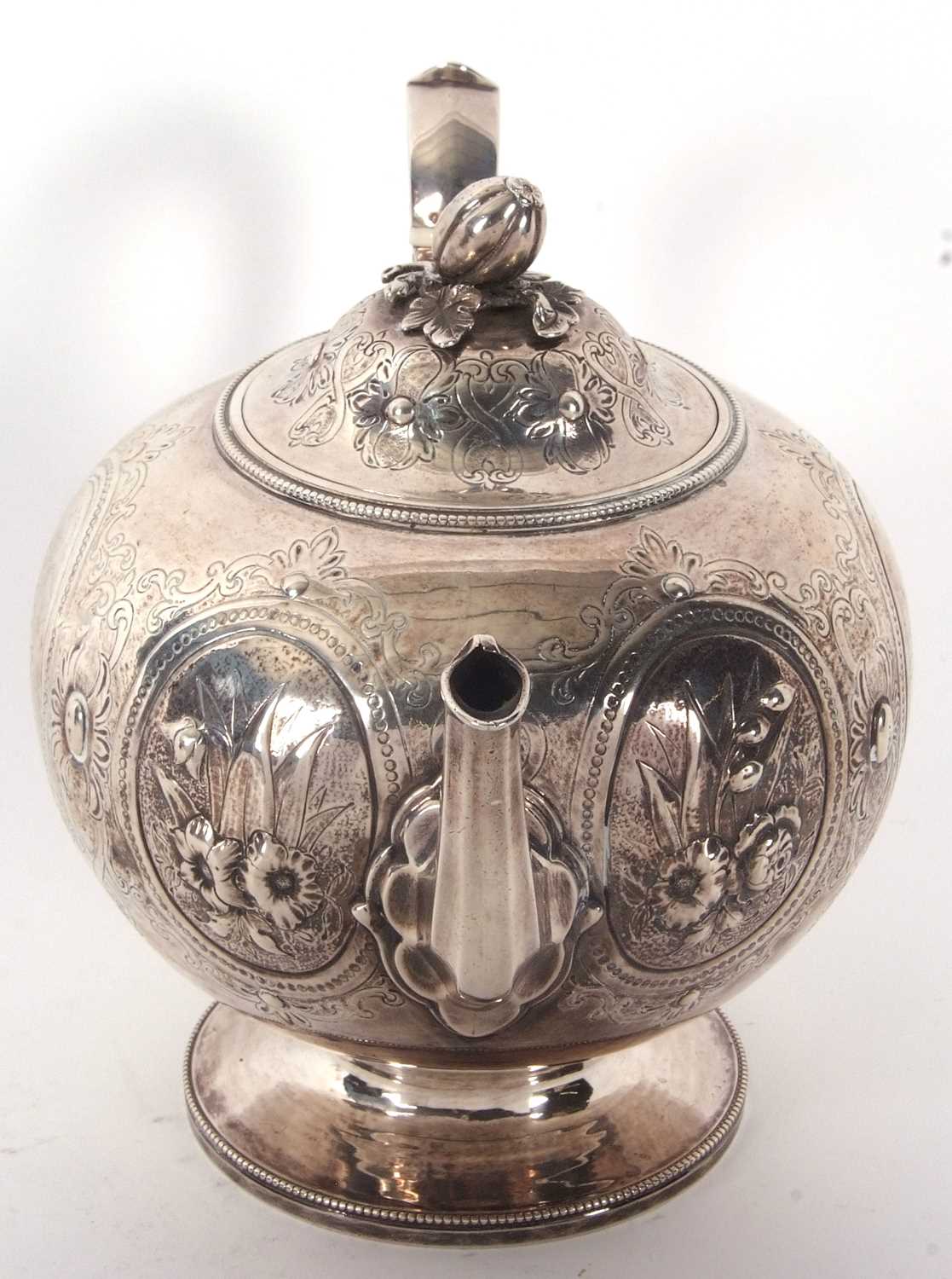 A Victorian silver teapot of globular bullet shaped onto a cast beaded circular spreading foot, - Image 4 of 7