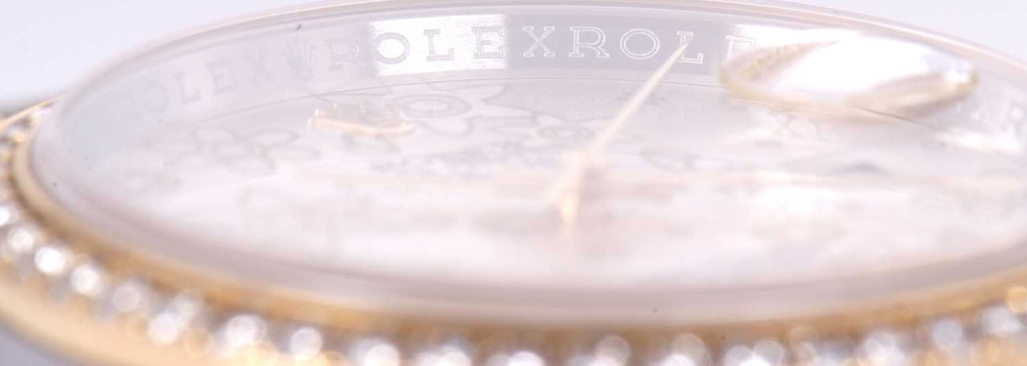 A Rolex Datejust 36, reference 116243, it has a two tone Oyster bracelet and a diamond bezel with - Image 13 of 18