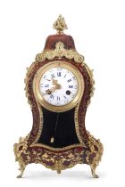 A 20th Century boulle type mantel clock with circular dial with Roman and Arabic numerals over a
