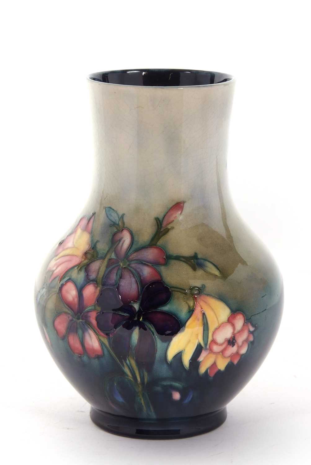 A Mid 20th Century Moorcroft vase of baluster form, the green ground with tubelined decoration of - Image 3 of 4