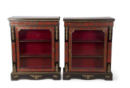 An opposing pair of 19th Century red boulle and ebonised side cabinets with single glazed doors
