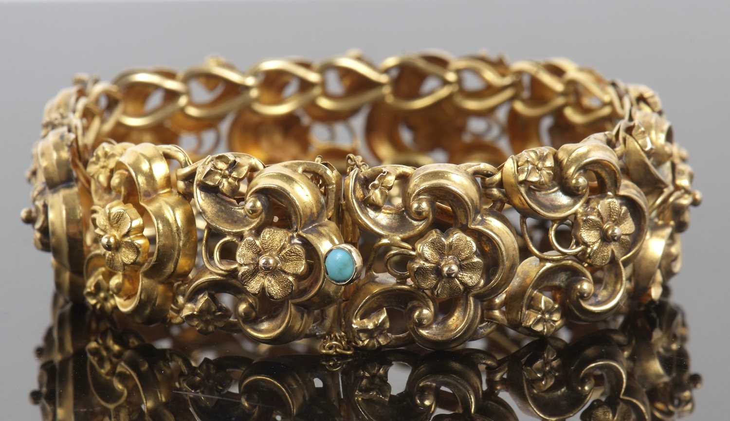 A 19th century bracelet, the articulated repousse links with floral centres, with integrated clasp - Image 4 of 9