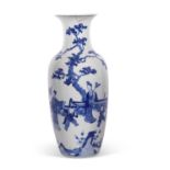 A large Chinese porcelain vase finely painted with Chinese figures amongst bamboo and rock work,