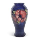 A large Moorcroft vase the blue ground decorated with tubelined anemone pattern with green signature