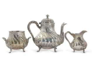Late Victorian Scottish silver three piece batchelor tea service of baluster form with an all over