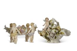 Two continental porcelain baskets one Sitzendorf with applied flowers and cherubs together with a
