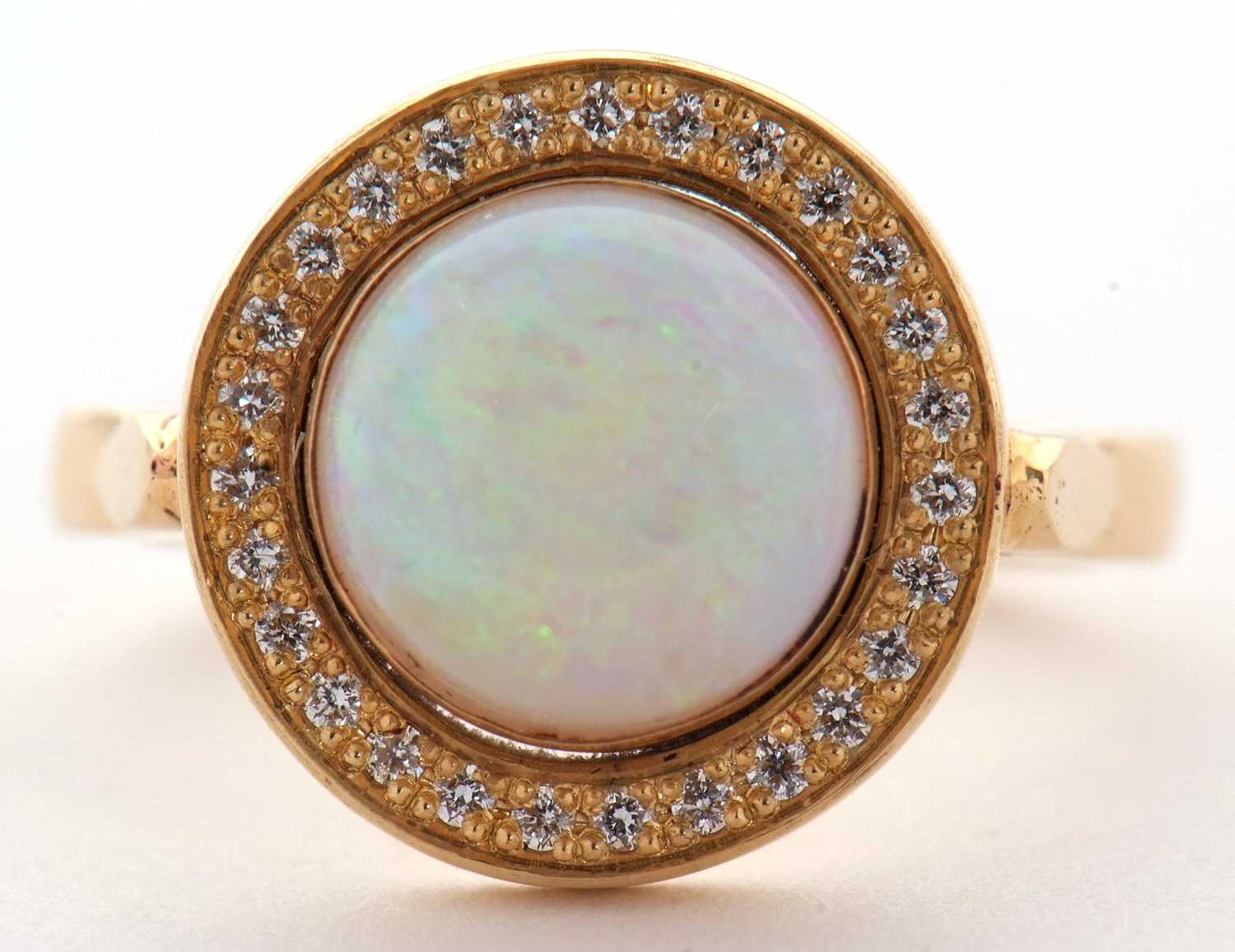 An opal and diamond ring, the round opal cabochon, approx. 9.4mm diameter, collet mounted and - Image 4 of 7