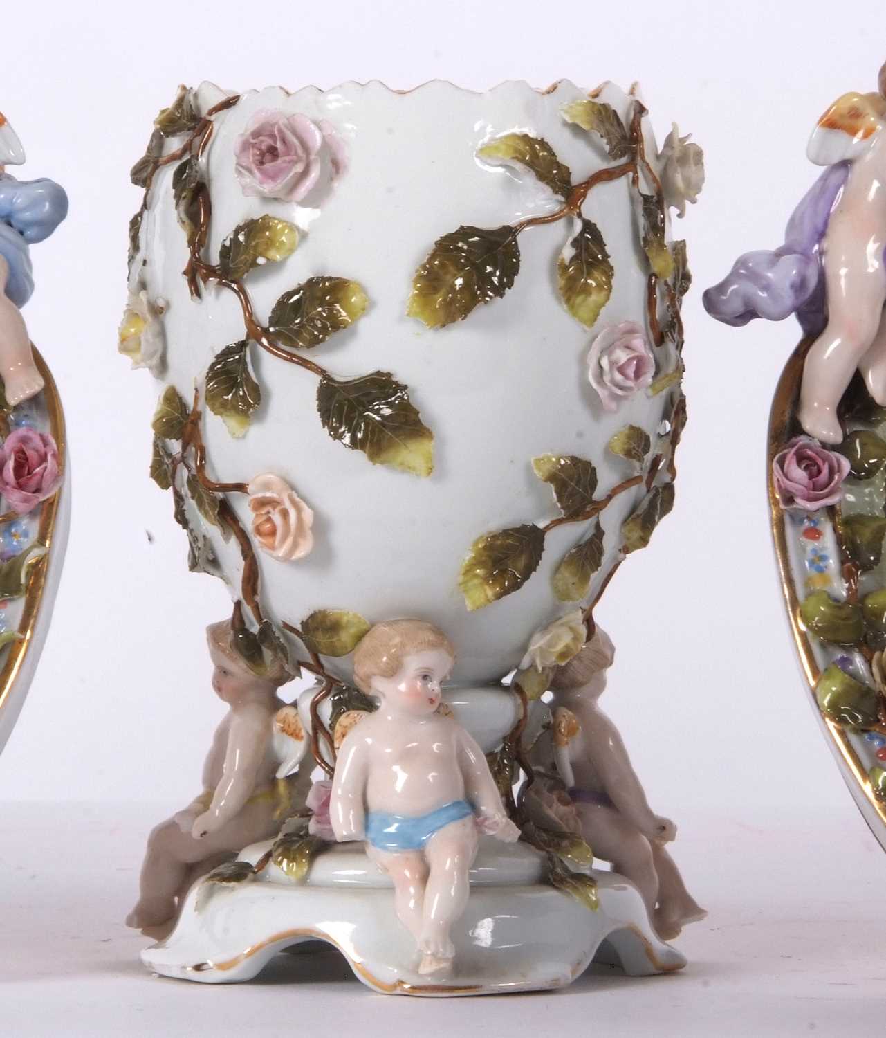 A Continental porcelain vase of oval shaped, supported by three cherubs, the base with Sitzendorf - Image 4 of 5