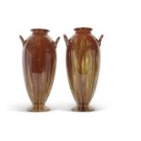 A tall pair of Linthorpe pottery vases the brown glaze with a streaked design, also with loop