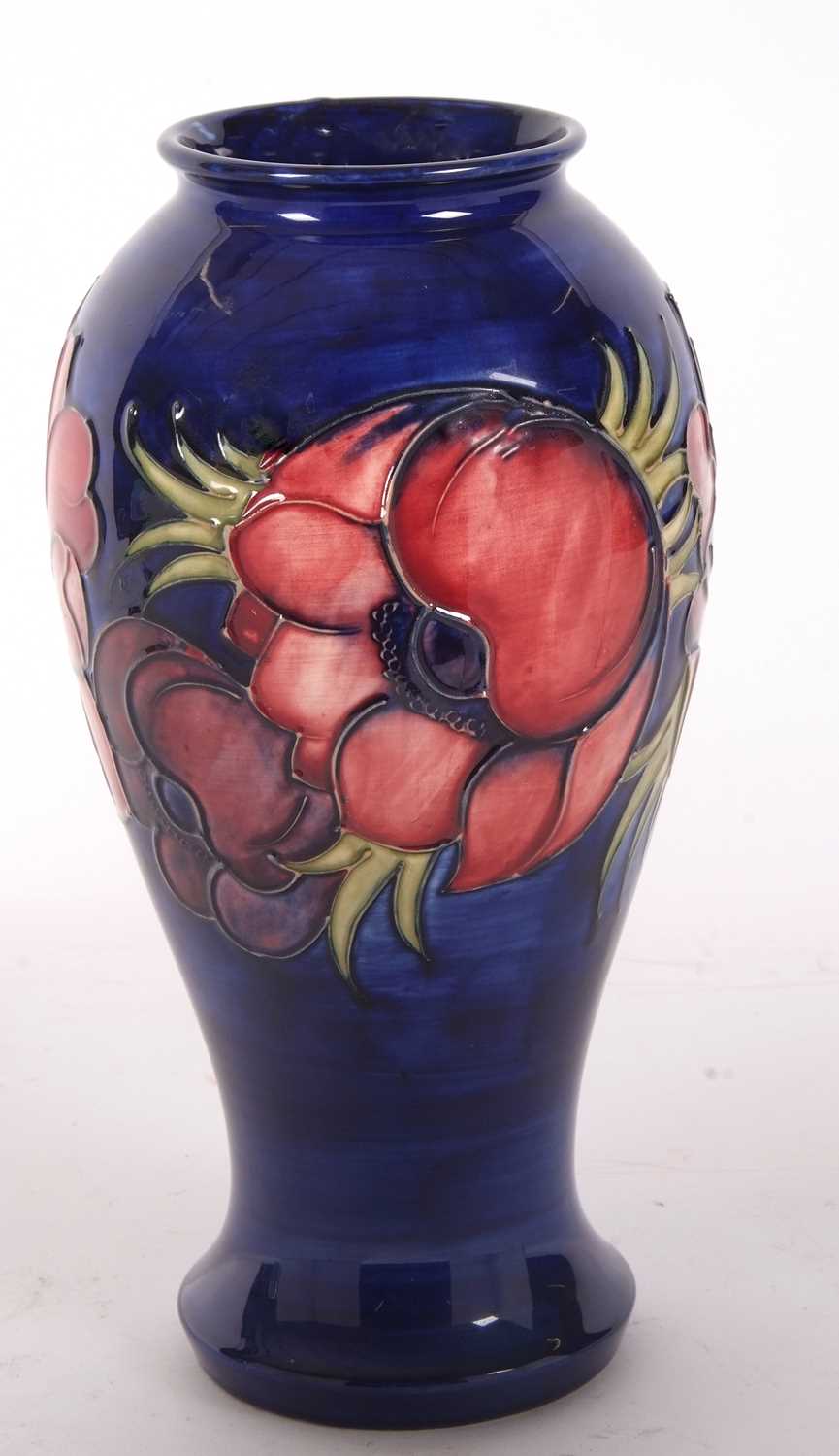 A large Moorcroft vase the blue ground decorated with tubelined anemone pattern with green signature - Image 2 of 5