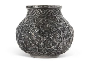 INDIAN KUTCH white metal baluster vase having an all over scrolling foliate patern in repouse and