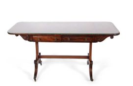 A Regency rosewood sofa table with two frieze drawers over shaped sabre legs with central