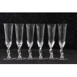 A set of Carl Faberge crystal glass champagne flutes, the bowls mounted on frosted kissing doves