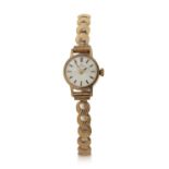 A 9ct gold cased ladies Eterna wrist watch on a 9ct gold bracelet, it has a manually crown wound