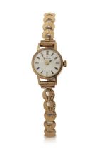 A 9ct gold cased ladies Eterna wrist watch on a 9ct gold bracelet, it has a manually crown wound