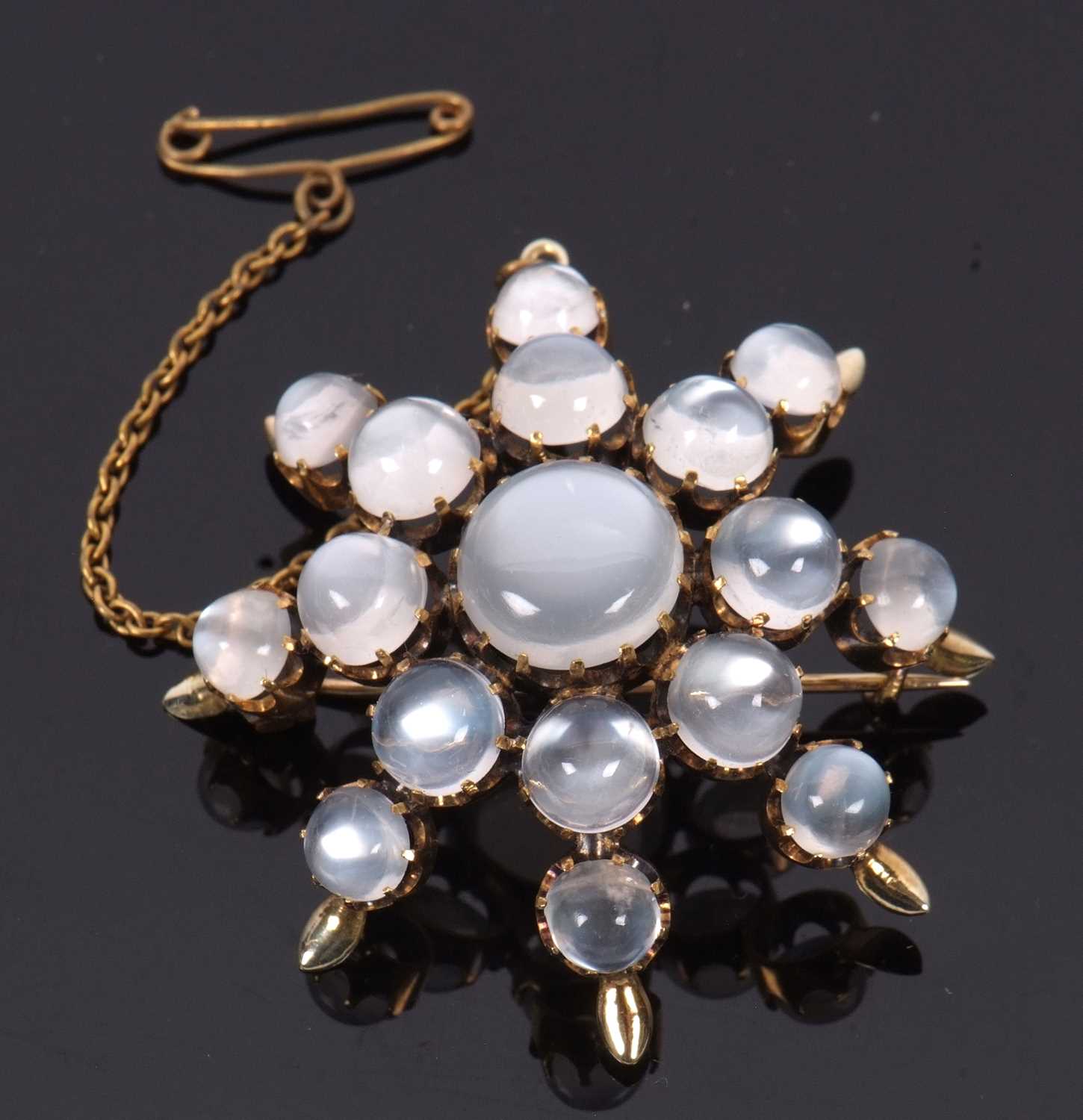 A moonstone 'star' brooch, the star shape comprised of graduated round moonstone cabochons, all claw - Image 4 of 7